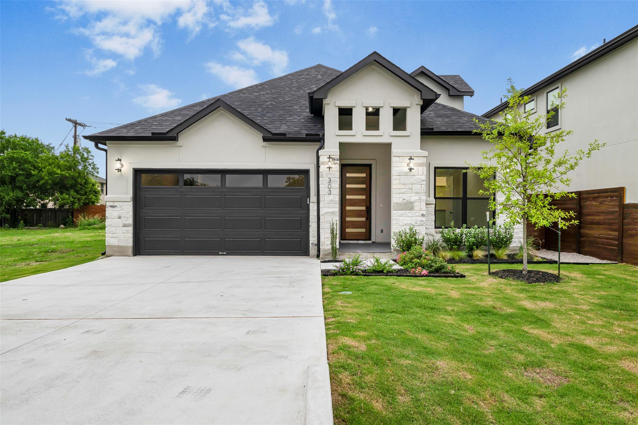 303  W Lane Ave, Manor, TX 78653 — photo 1