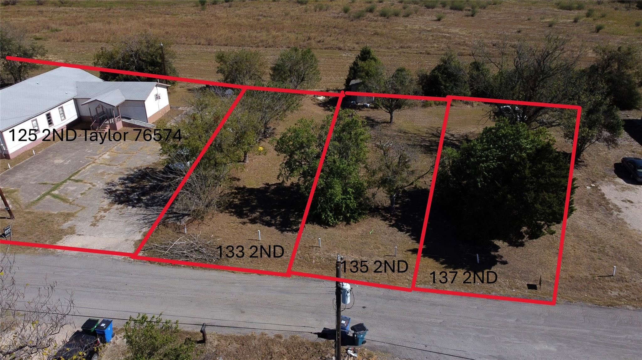 133 2nd, Taylor, TX 76574 — photo 1