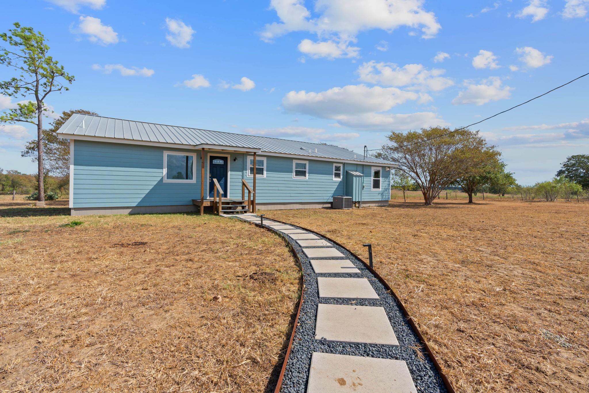 154 Caracara, Dale, TX 78616 — photo 1