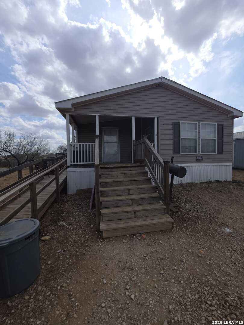 311 E Frio St, Dilley, TX 78017 — photo 1