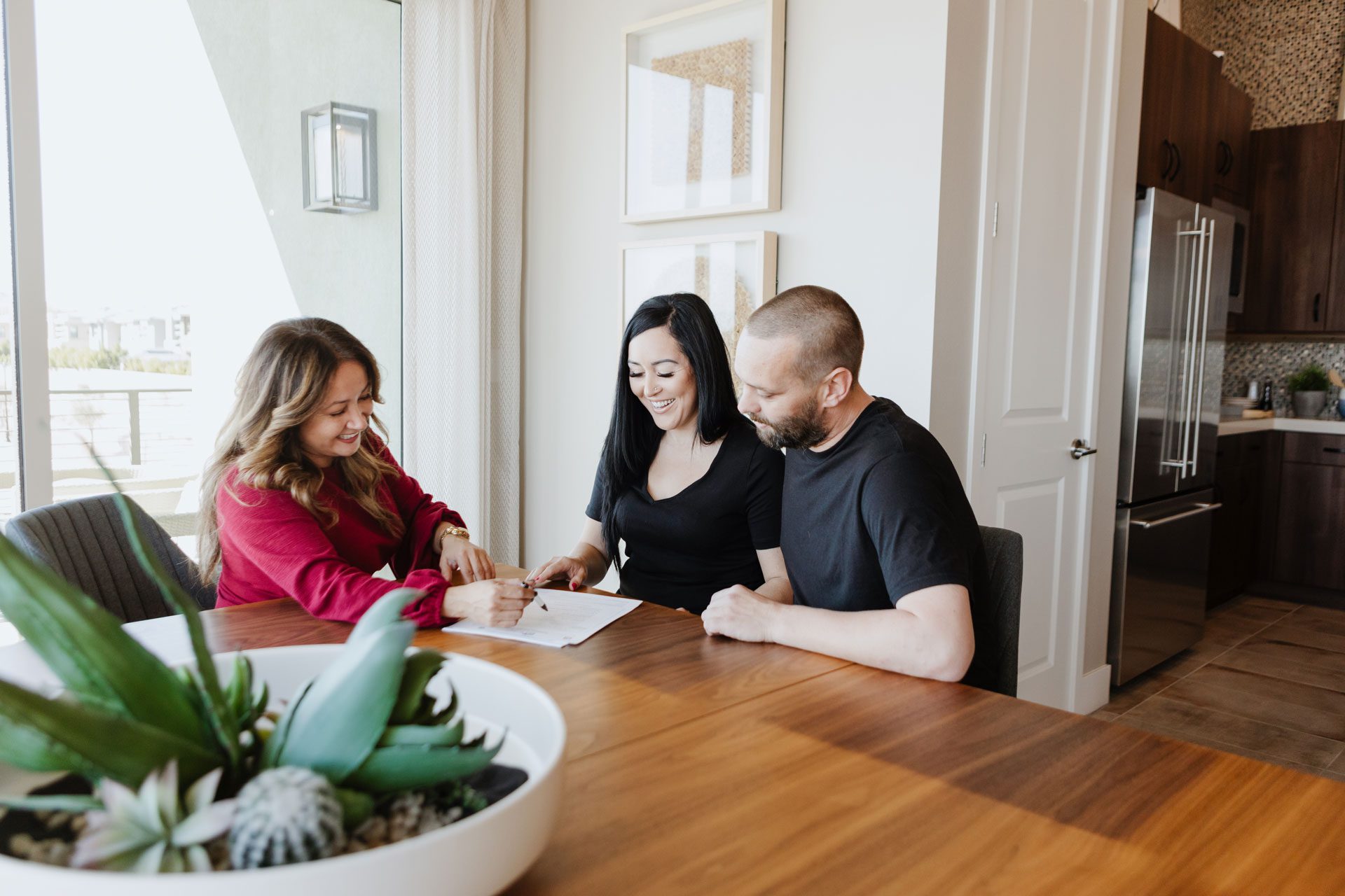 Real estate agent helping young couple understand the market