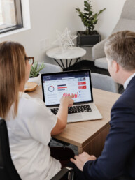 two people looking at computer screen