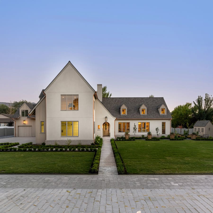 Contemporary estate with pool at dusk